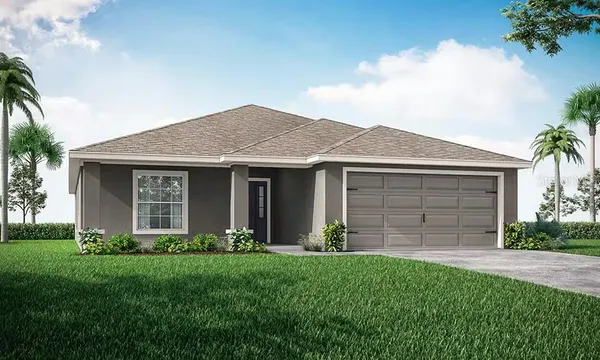 a front view of a house with a garden and plants