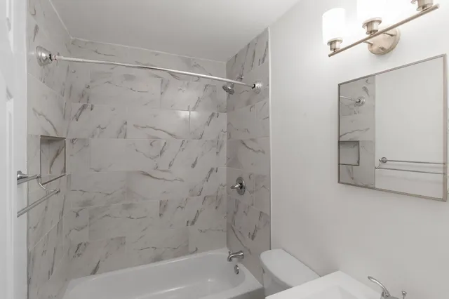 a bathroom with a shower and bathtub