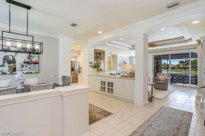 9871 Rookery Circle Estero, FL 33928 - Photo 12 of 38 a kitchen with a sink cabinets and counter top space