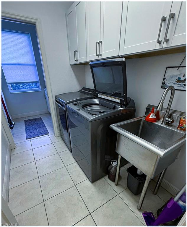 9871 Rookery Circle Estero, FL 33928 - Photo 16 of 33 a stove top oven sitting inside of a kitchen