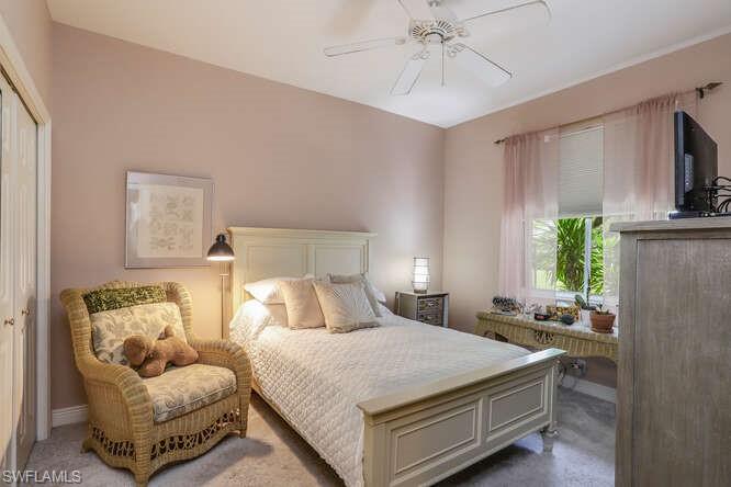 9871 Rookery Circle Estero, FL 33928 - Photo 18 of 38 a bedroom with a bed and window