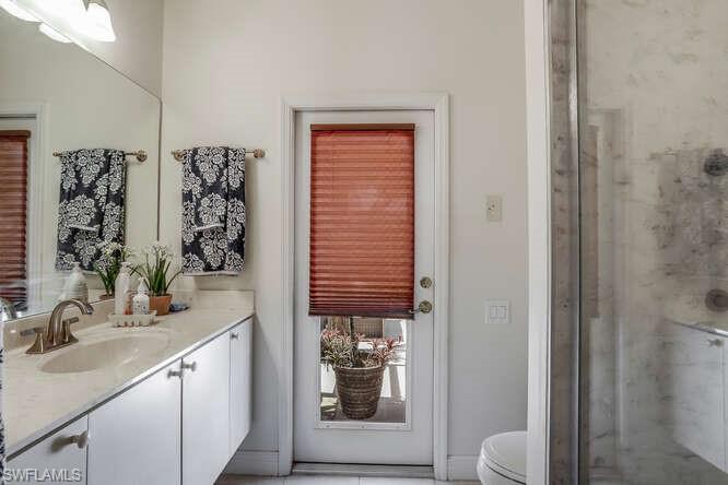 9871 Rookery Circle Estero, FL 33928 - Photo 19 of 38 a bathroom with a sink a toilet and shower