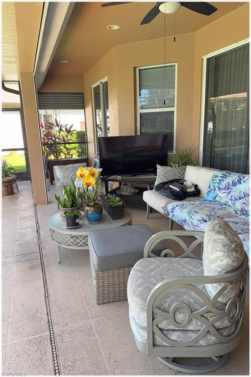 9871 Rookery Circle Estero, FL 33928 - Photo 19 of 33 a living room with furniture and a flat screen tv