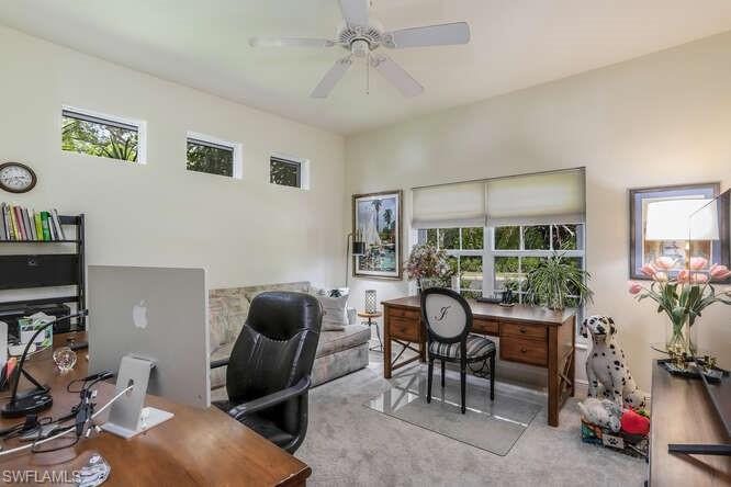 9871 Rookery Circle Estero, FL 33928 - Photo 21 of 38 a living room with furniture and a flat screen tv