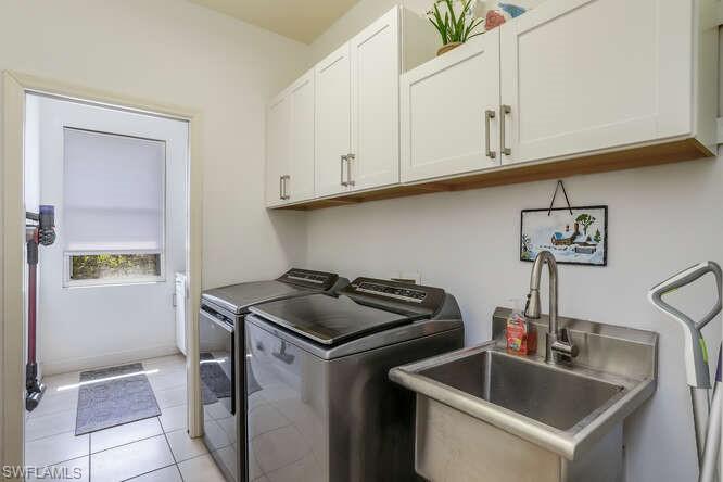 9871 Rookery Circle Estero, FL 33928 - Photo 22 of 38 a kitchen that has a sink and a stove