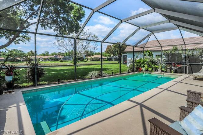 9871 Rookery Circle Estero, FL 33928 - Photo 25 of 38 a view of a backyard with wooden fence
