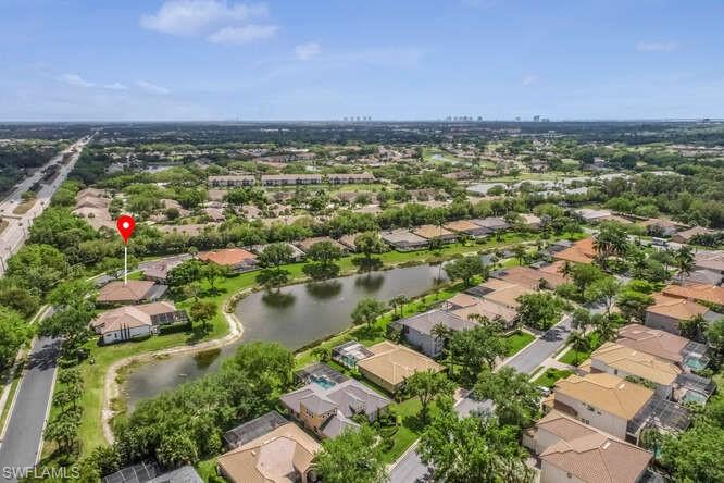 9871 Rookery Circle Estero, FL 33928 - Photo 30 of 38 an aerial view of residential houses with outdoor space and trees