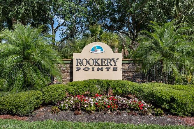 9871 Rookery Circle Estero, FL 33928 - Photo 31 of 38 a sign that is sitting in front of flowers