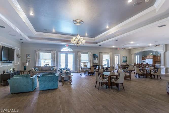 9871 Rookery Circle Estero, FL 33928 - Photo 35 of 38 a living room with furniture kitchen view and a large window