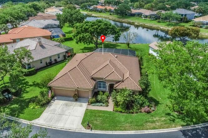 9871 Rookery Circle Estero, FL 33928 - Photo 4 of 38 an aerial view of a house with a yard and lake view