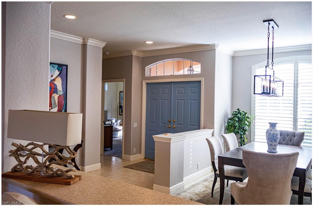 9871 Rookery Circle Estero, FL 33928 - Photo 5 of 33 a view of a livingroom with furniture and windows