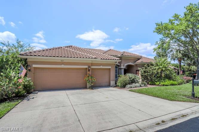 9871 Rookery Circle Estero, FL 33928 - Photo 6 of 38 a front view of a house with yard
