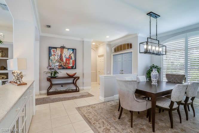 9871 Rookery Circle Estero, FL 33928 - Photo 8 of 38 a dining room with furniture and window