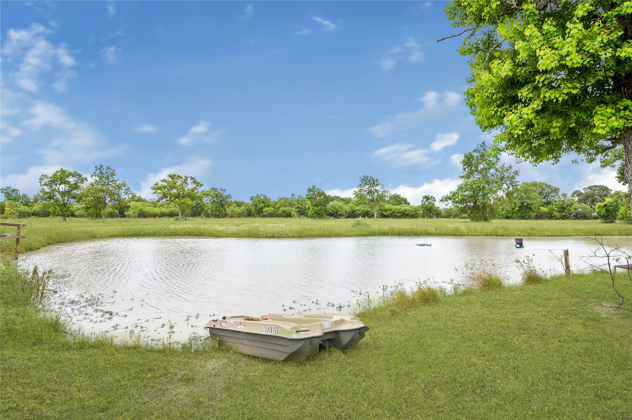868 Lisa May Road Bellville, TX 77418 - Photo 17 of 39 a view of a lake with houses in the back