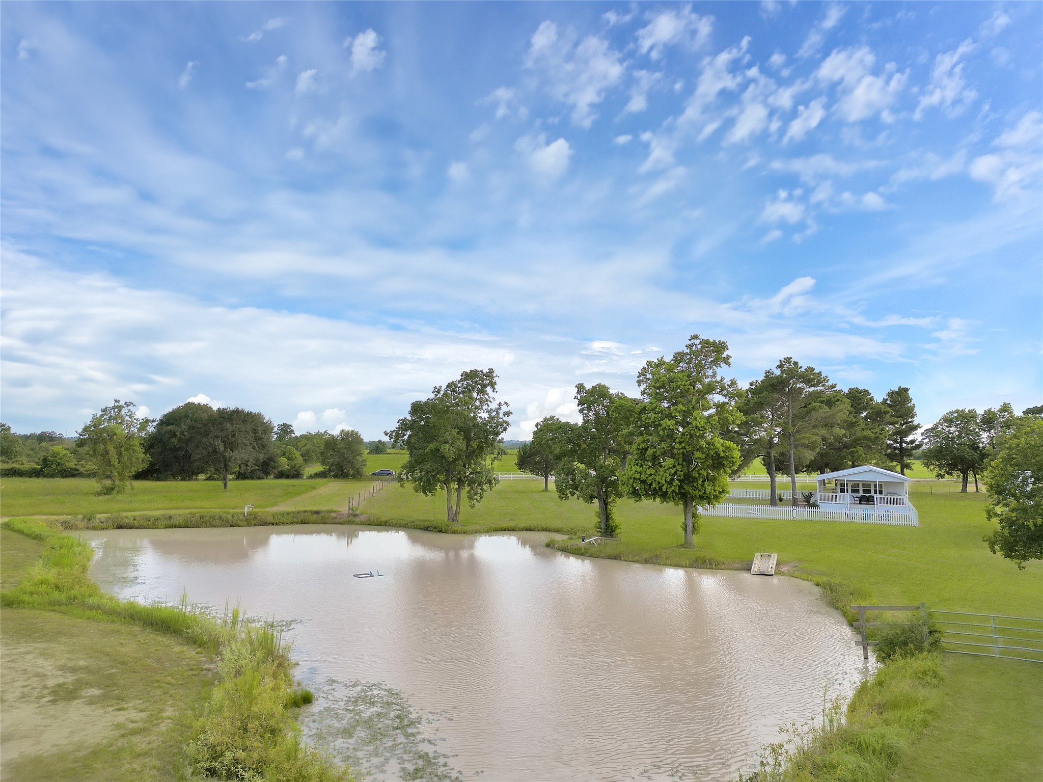 868 Lisa May Road Bellville, TX 77418 - Photo 18 of 39 a view of a lake with a yard