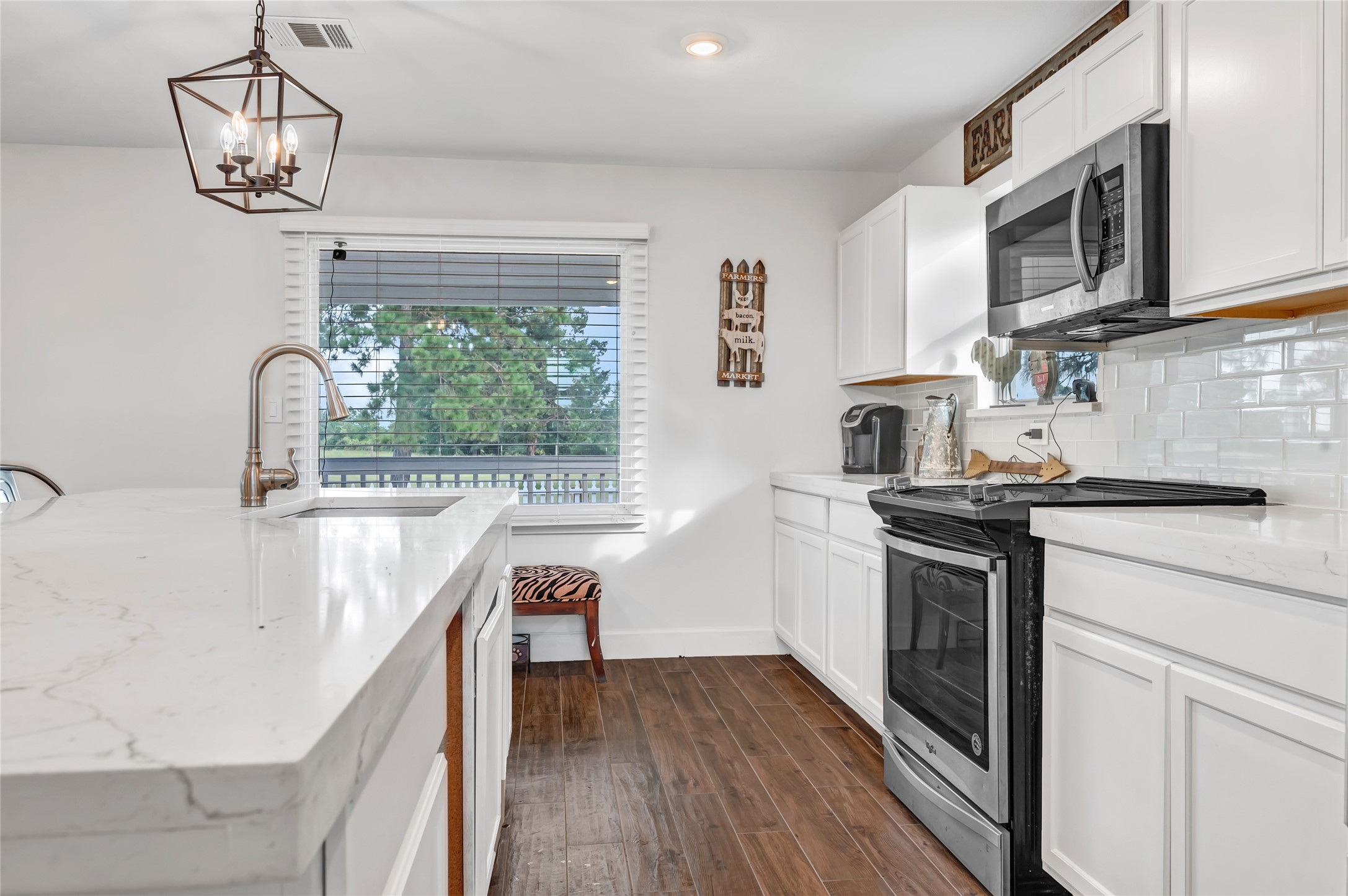868 Lisa May Road Bellville, TX 77418 - Photo 23 of 39 a kitchen with stainless steel appliances granite countertop a sink and stove top oven