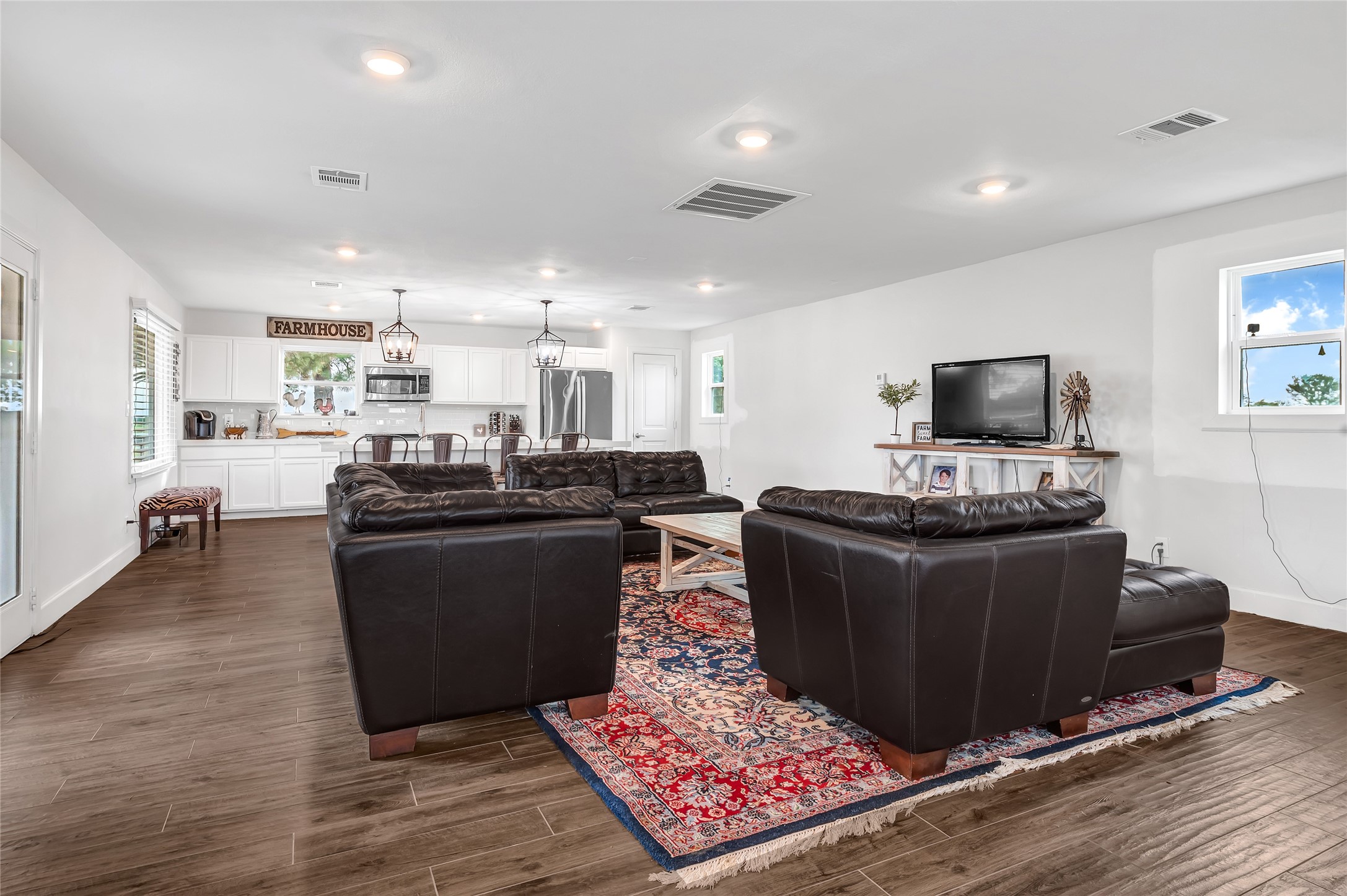 868 Lisa May Road Bellville, TX 77418 - Photo 25 of 39 a living room with furniture and a flat screen tv