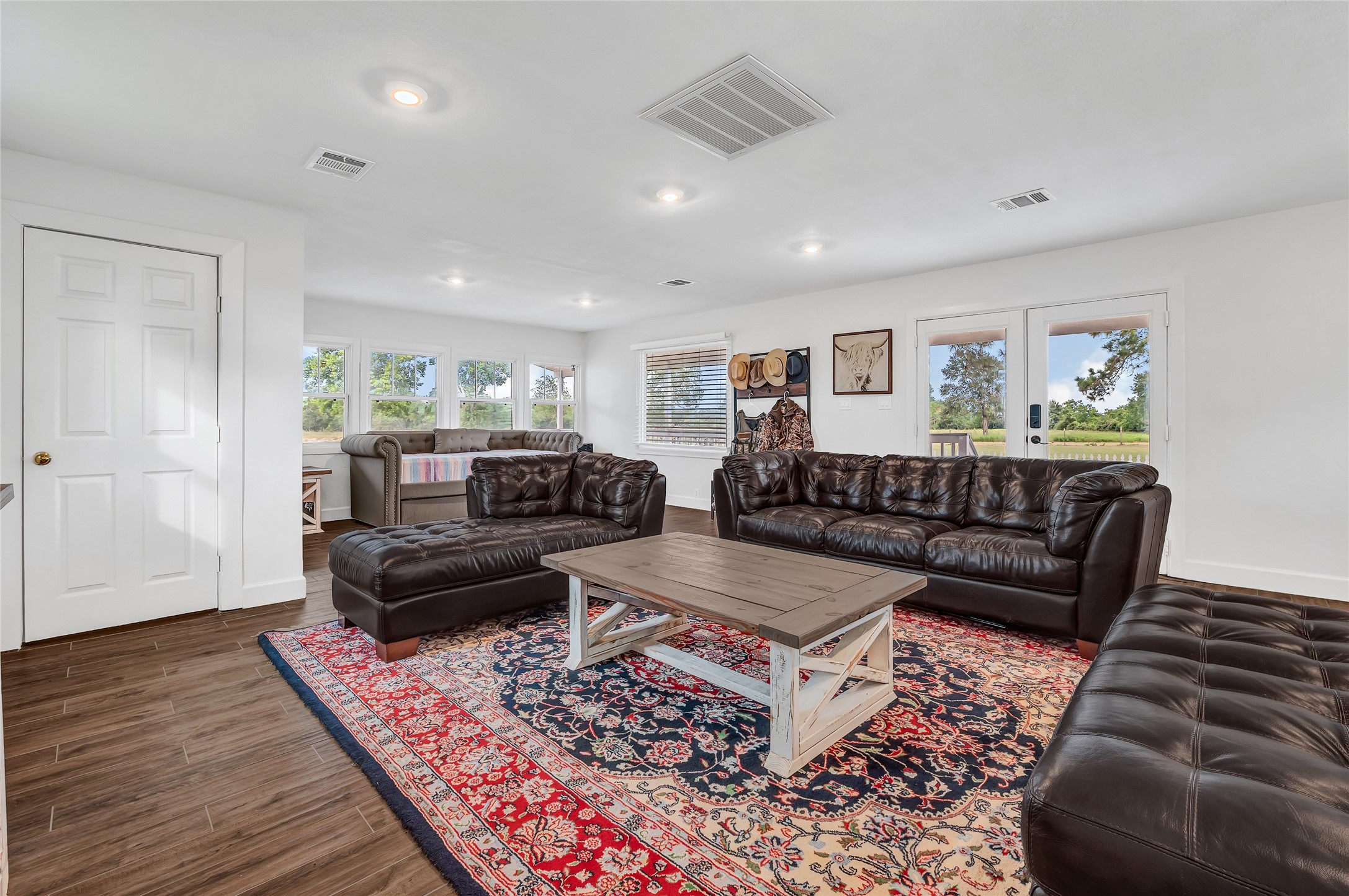 868 Lisa May Road Bellville, TX 77418 - Photo 26 of 39 a living room with furniture and a rug