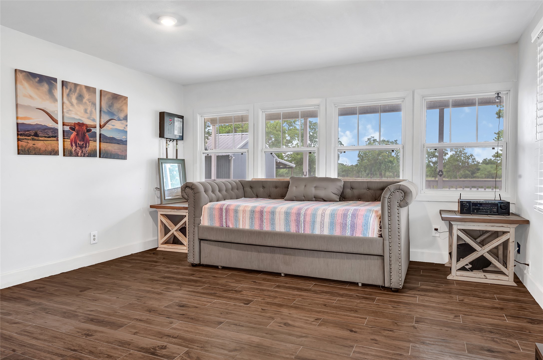 868 Lisa May Road Bellville, TX 77418 - Photo 28 of 39 a living room with furniture and a floor to ceiling window