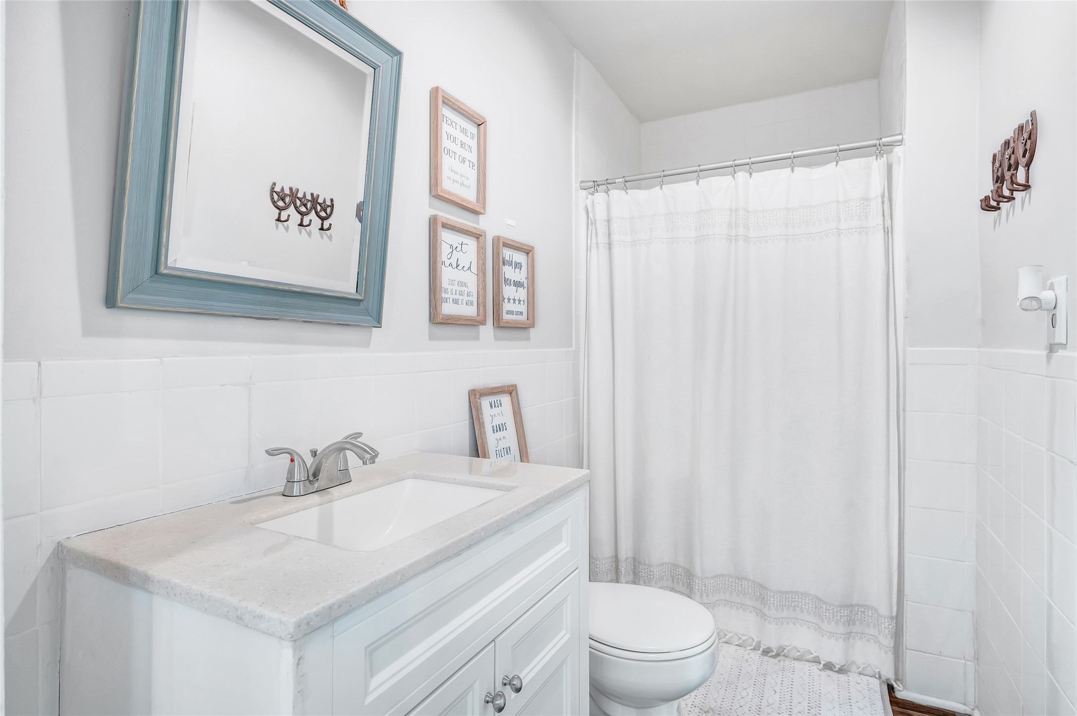 868 Lisa May Road Bellville, TX 77418 - Photo 29 of 39 a bathroom with a sink a toilet and shower curtain