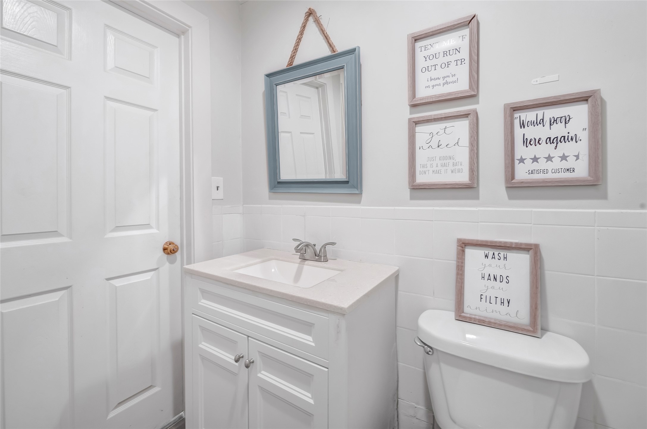 868 Lisa May Road Bellville, TX 77418 - Photo 30 of 39 a bathroom with a toilet sink and mirror