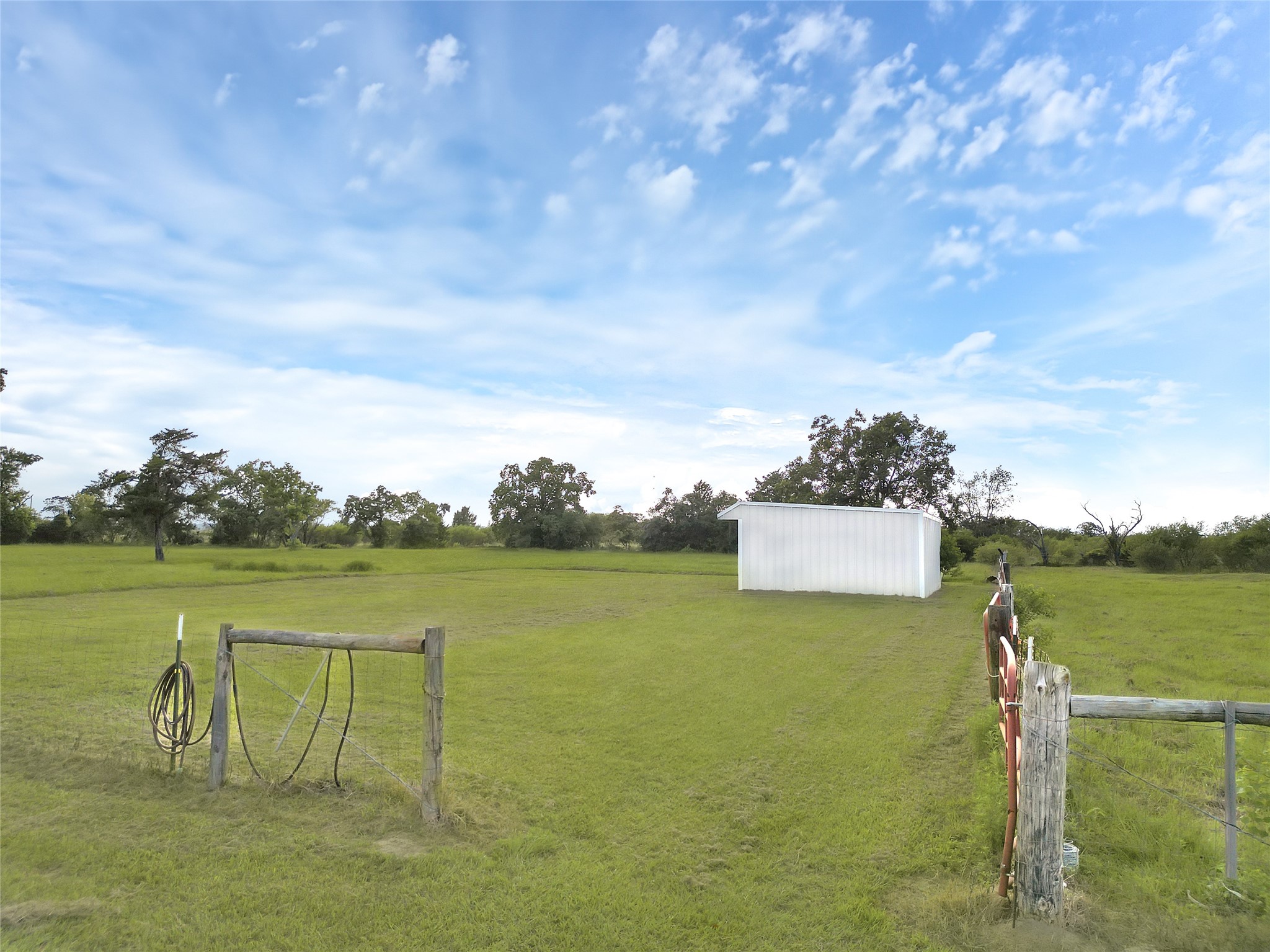 868 Lisa May Road Bellville, TX 77418 - Photo 34 of 39 a view of a lake with houses in the background
