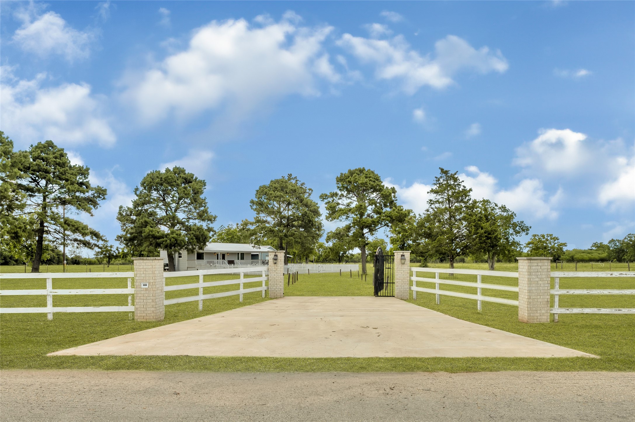 868 Lisa May Road Bellville, TX 77418 - Photo 9 of 39 a view of a house with a backyard