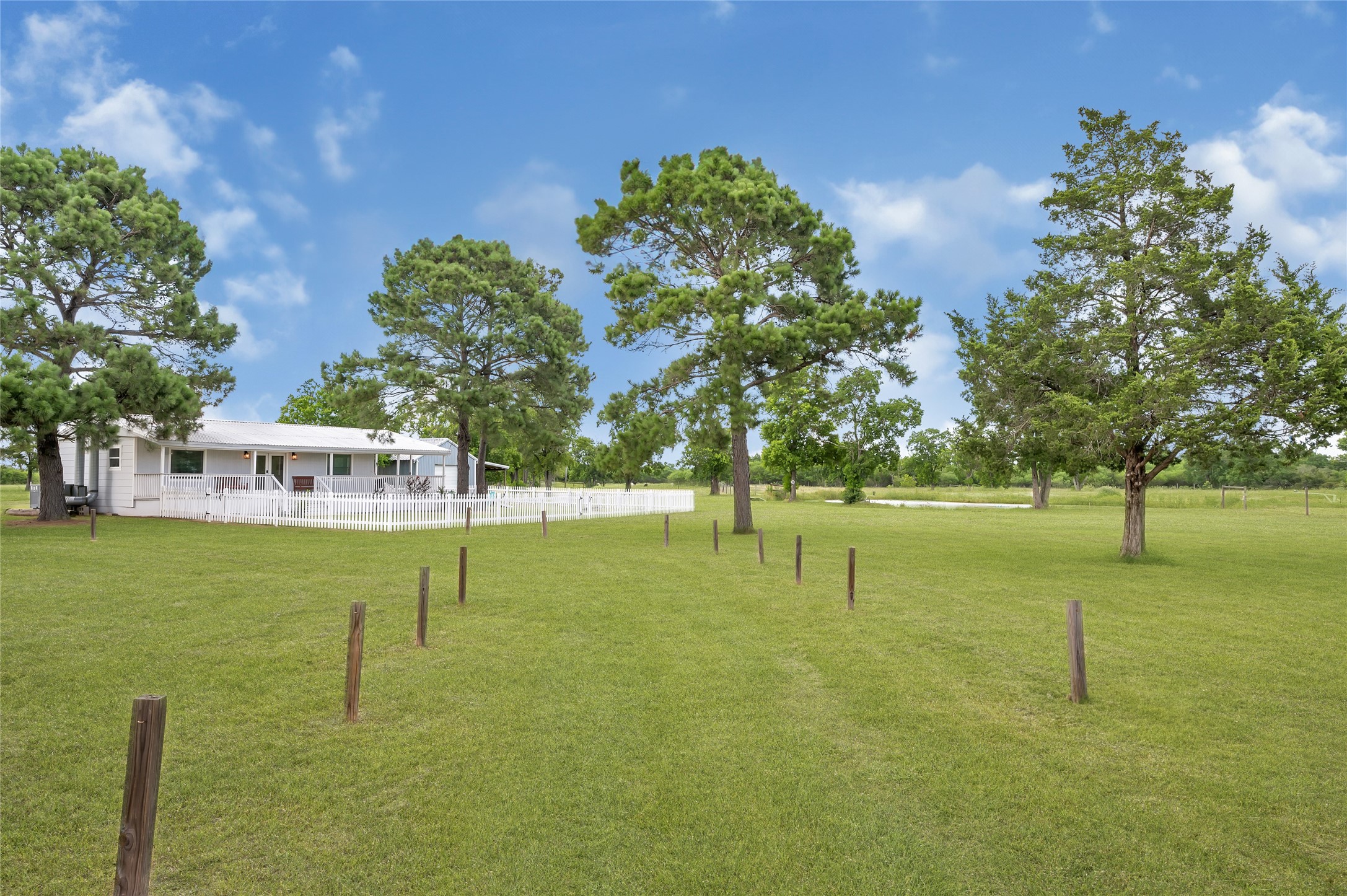868 Lisa May Road Bellville, TX 77418 - Photo 10 of 39 a view of yard with swimming pool and green space