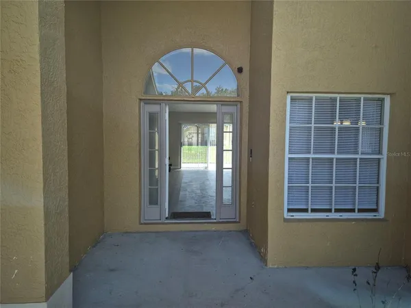 a view of a house with a door and a window