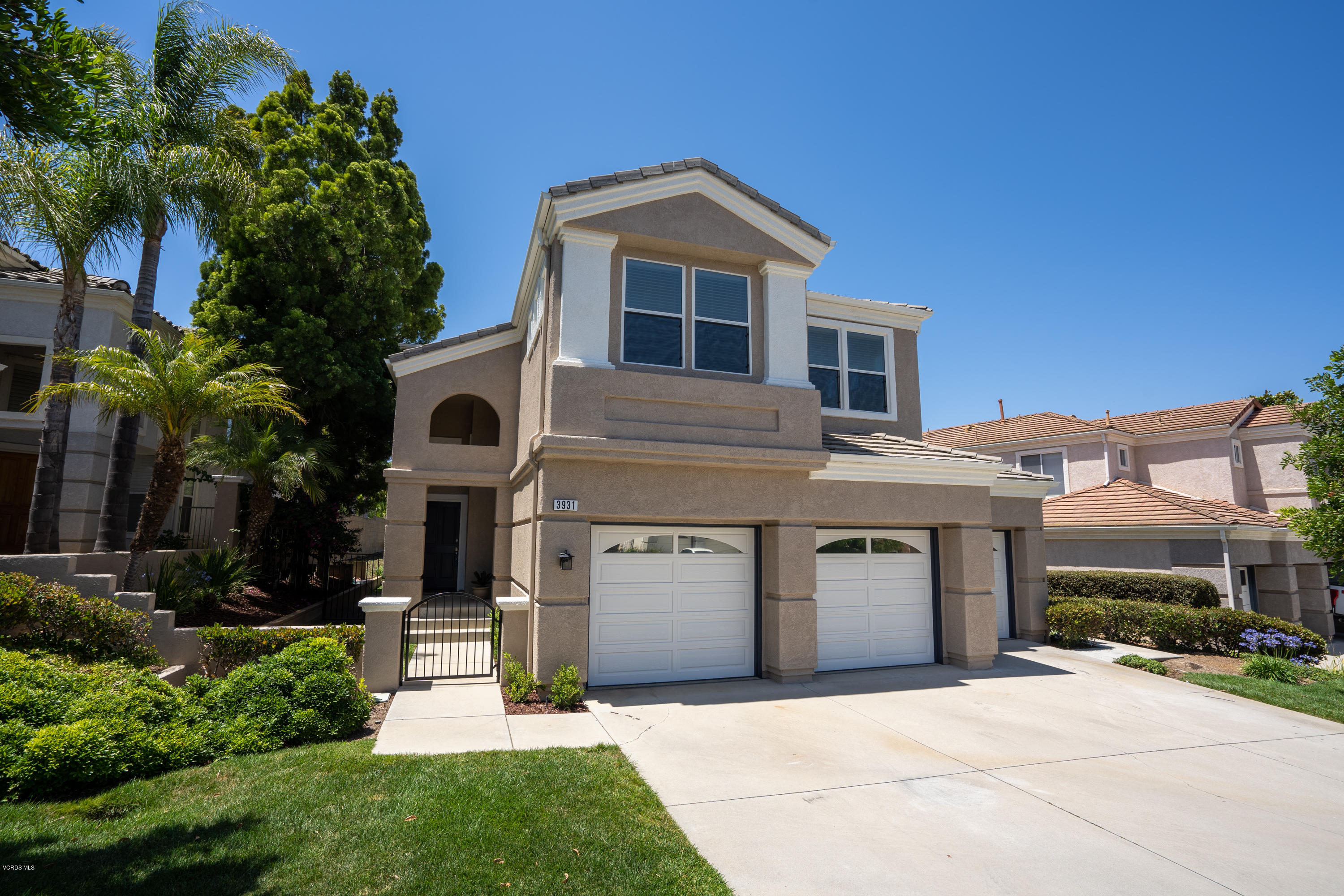 3931 Sunsetridge Road Moorpark, CA 93021 - Photo 1 of 36 a front view of a house with a yard and garage