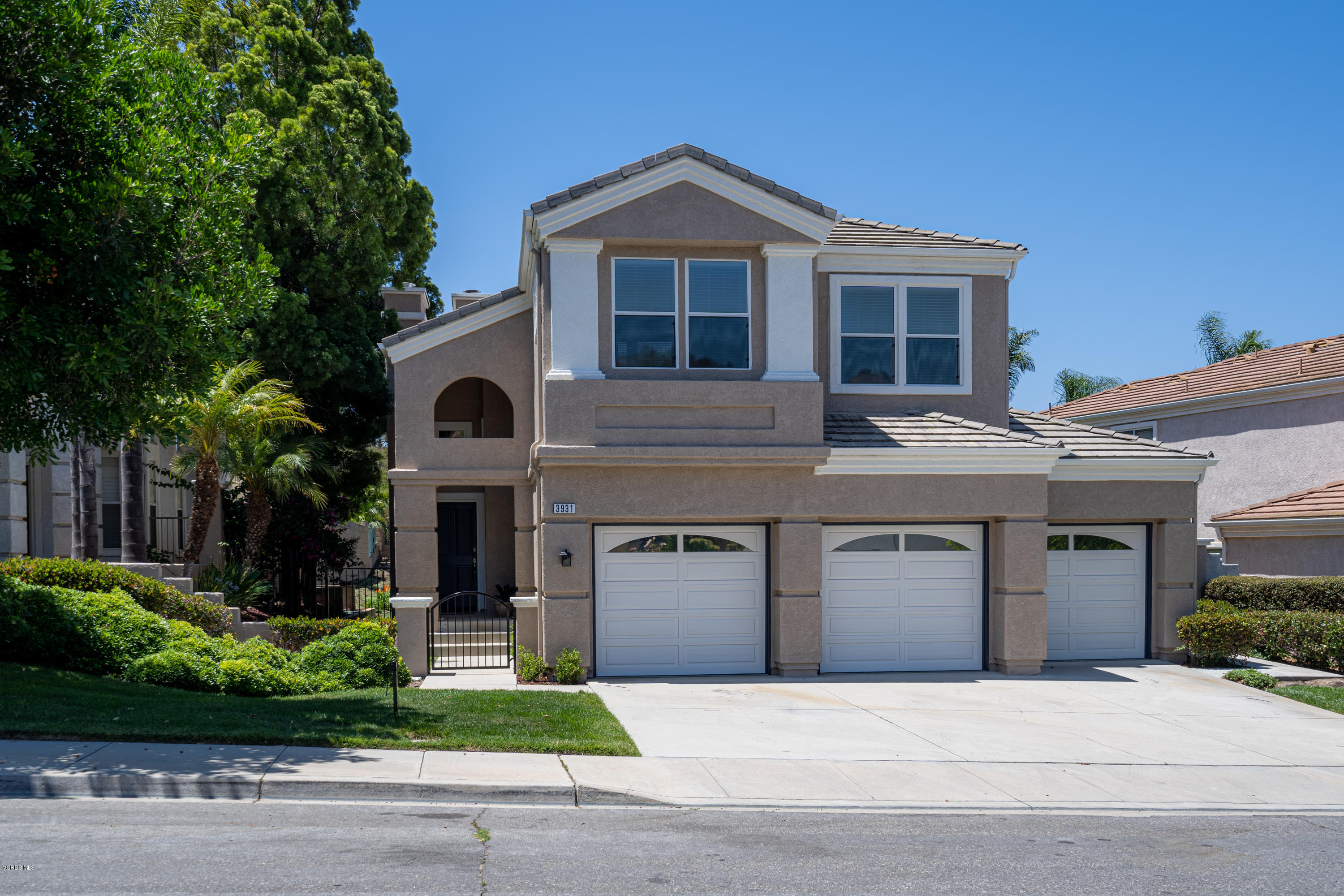 3931 Sunsetridge Road Moorpark, CA 93021 - Photo 2 of 36 a front view of a house with a garden
