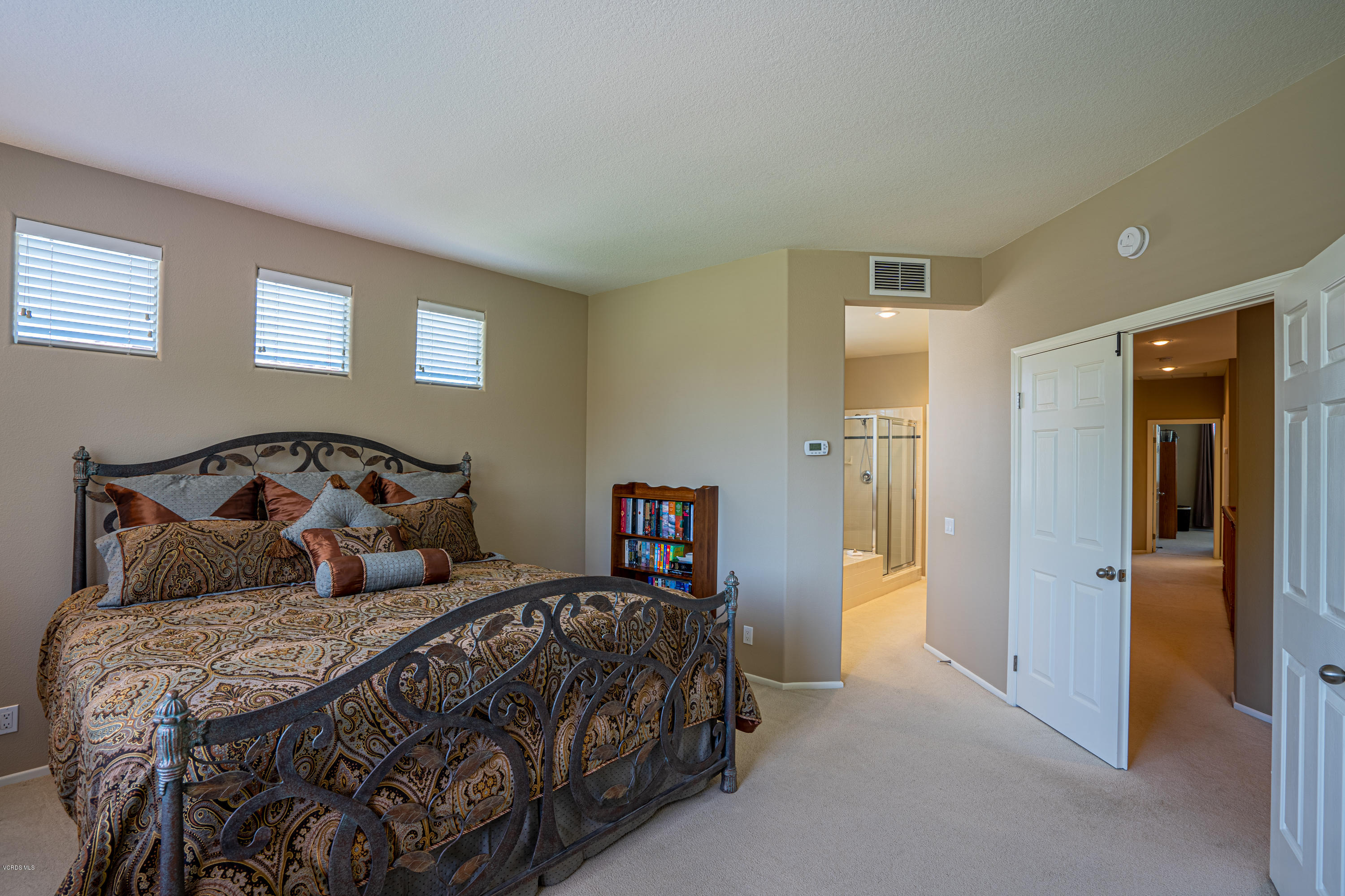3931 Sunsetridge Road Moorpark, CA 93021 - Photo 17 of 36 a bedroom with a large bed and a window