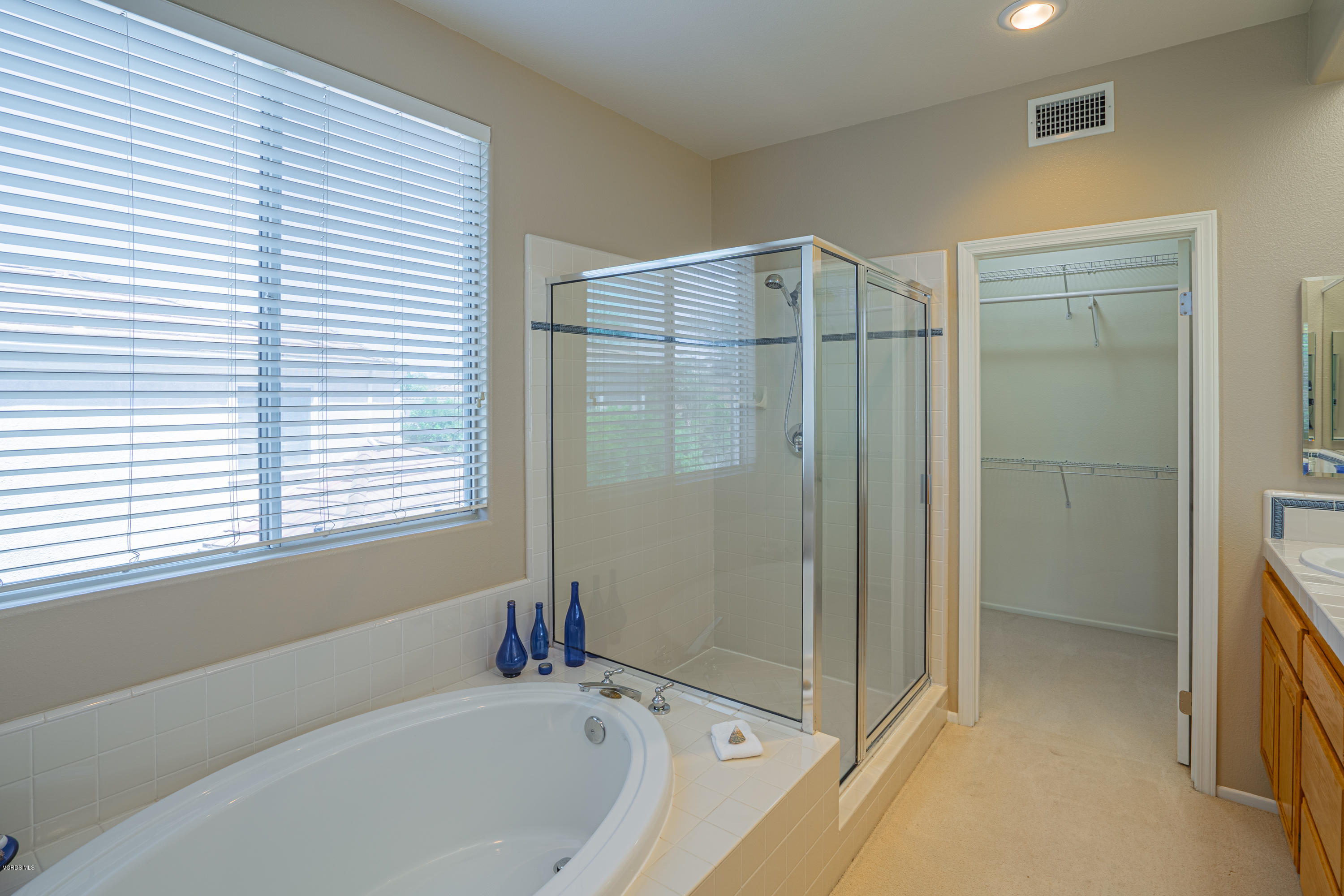 3931 Sunsetridge Road Moorpark, CA 93021 - Photo 18 of 36 a bathroom with a bathtub and a shower