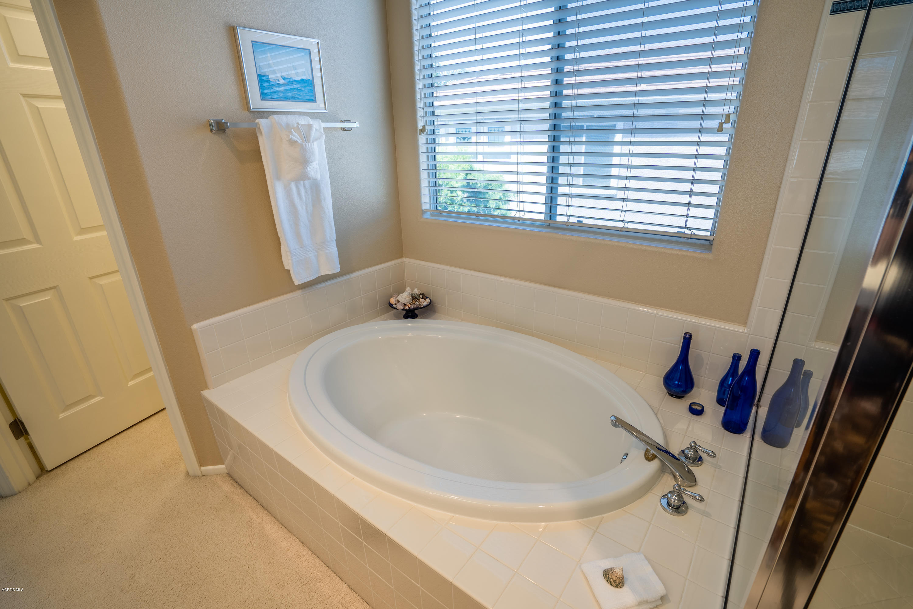 3931 Sunsetridge Road Moorpark, CA 93021 - Photo 19 of 36 a white bath tub sitting in a bathroom next to a window