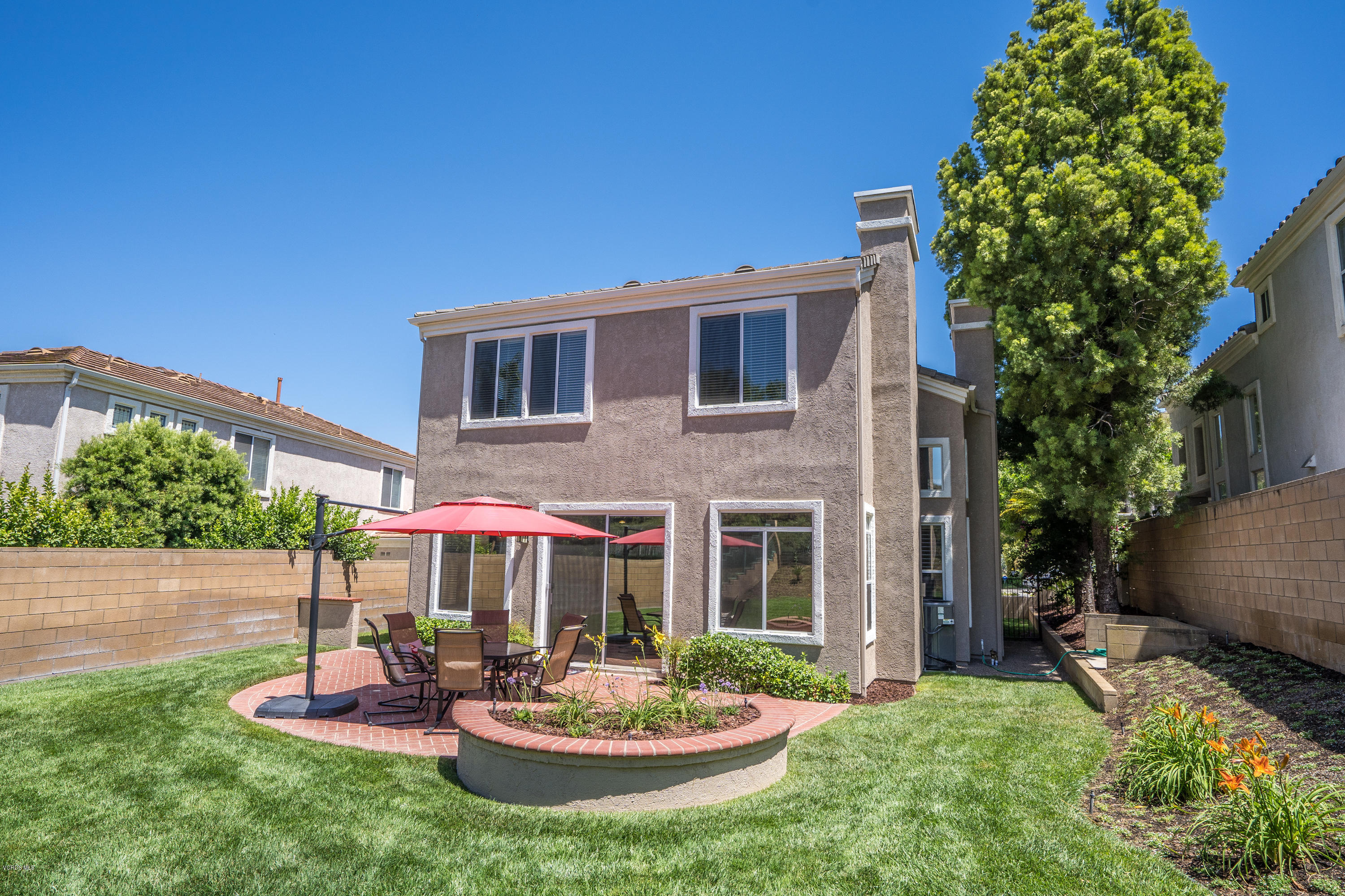 3931 Sunsetridge Road Moorpark, CA 93021 - Photo 25 of 36 a view of a house with a yard and sitting area