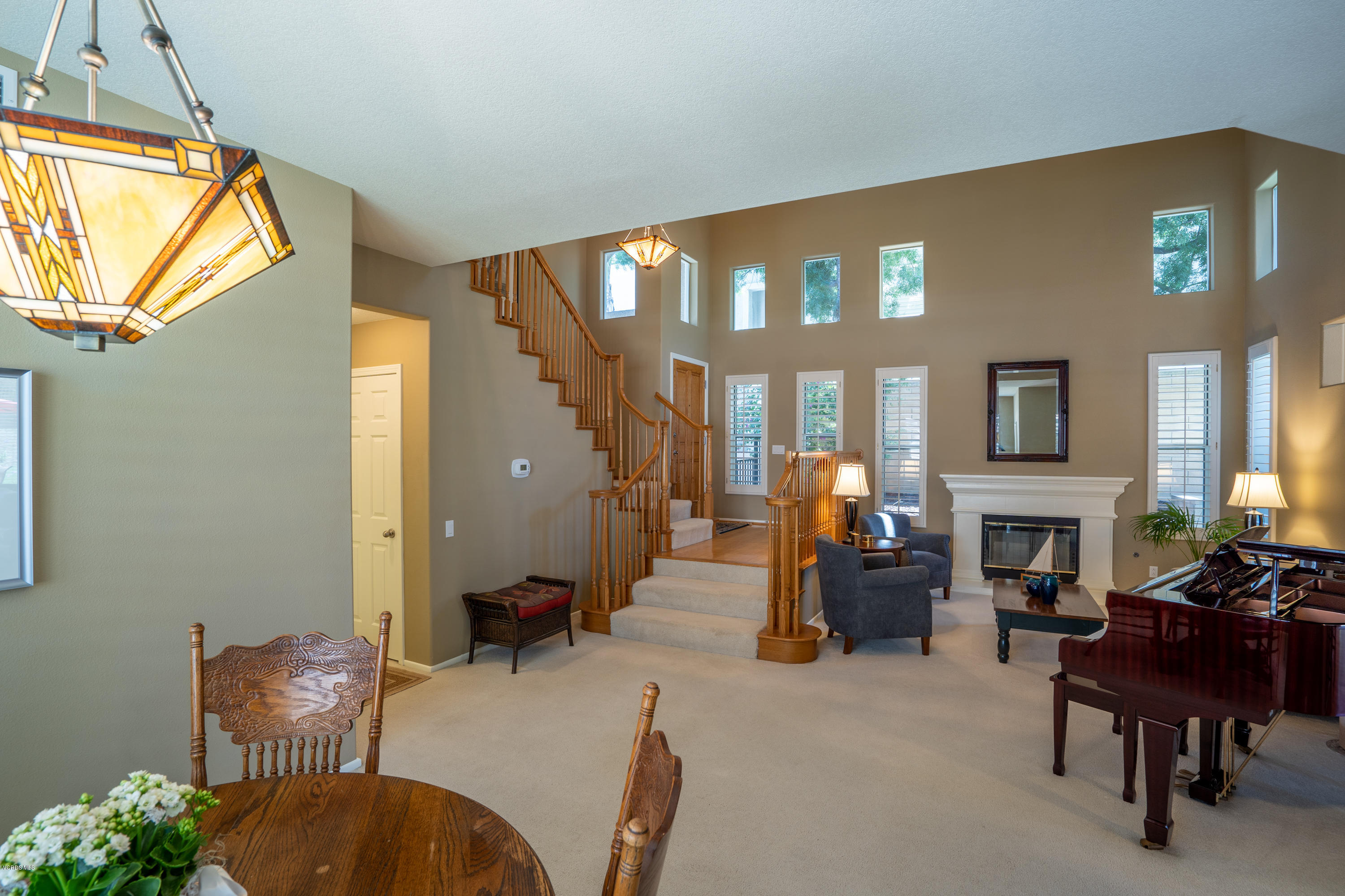 3931 Sunsetridge Road Moorpark, CA 93021 - Photo 6 of 36 a living room with furniture a chandelier and a window