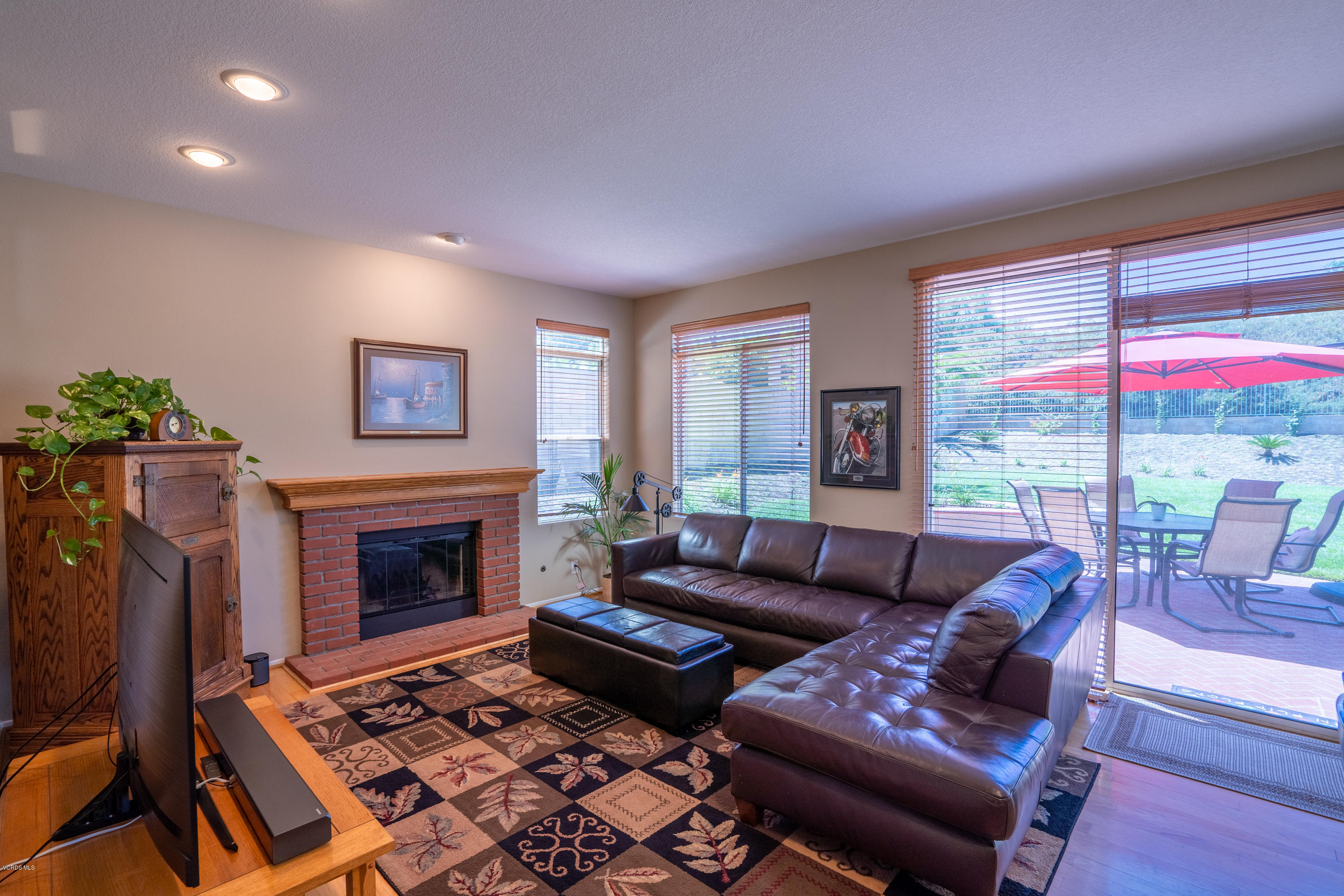 3931 Sunsetridge Road Moorpark, CA 93021 - Photo 10 of 36 a living room with furniture or couch and a fireplace
