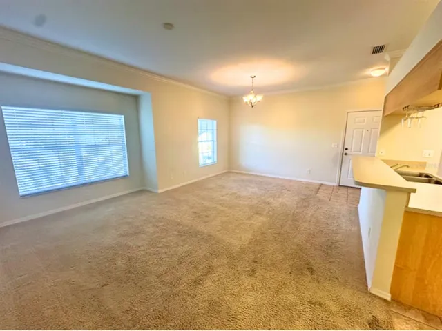 a view of an empty room with a fireplace