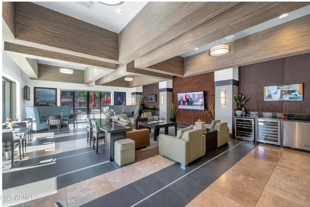 a living room with furniture and flat screen tv