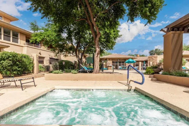 a view of a swimming pool with a lounge chair