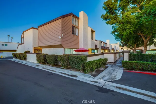 a front view of a house with a yard and outdoor seating