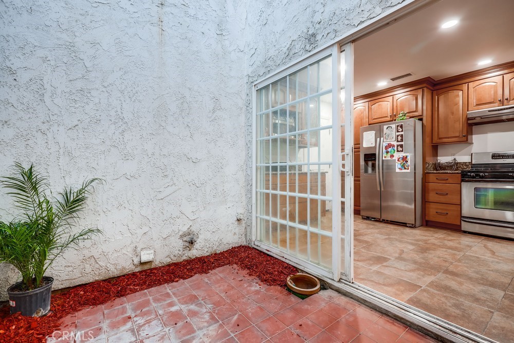 9678 Walker Court Cypress, CA 90630 - Photo 16 of 40 a bathroom with a tub and shower