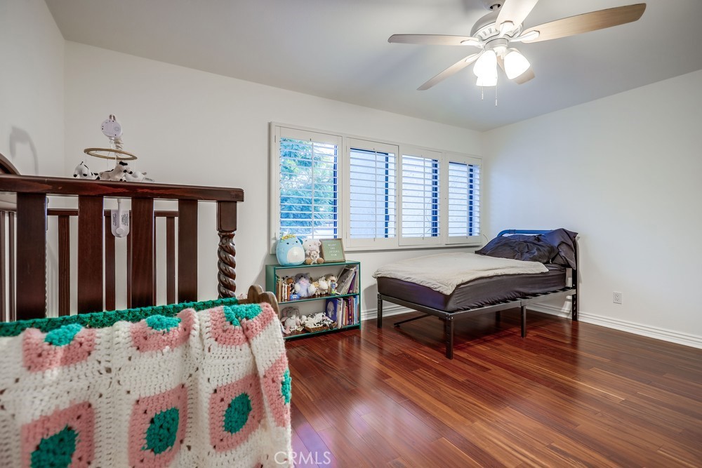 9678 Walker Court Cypress, CA 90630 - Photo 19 of 40 a bedroom with furniture and a window