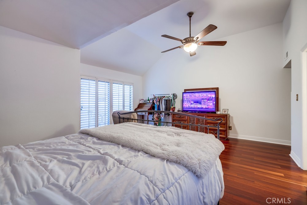 9678 Walker Court Cypress, CA 90630 - Photo 28 of 40 a bed room with a bed and a chandelier