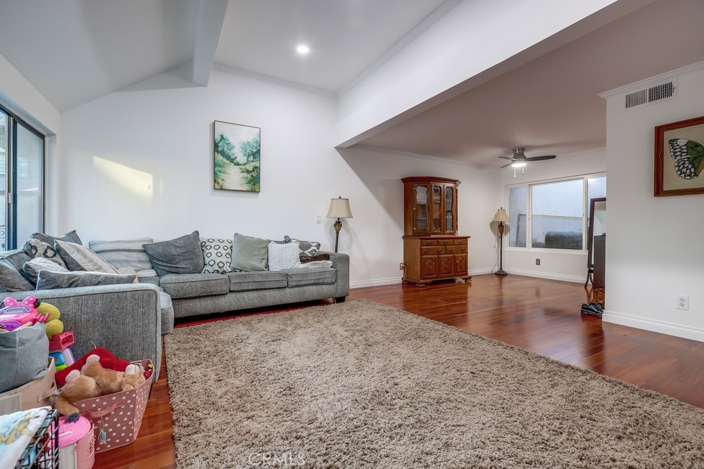 9678 Walker Court Cypress, CA 90630 - Photo 3 of 40 a living room with furniture and wooden floor