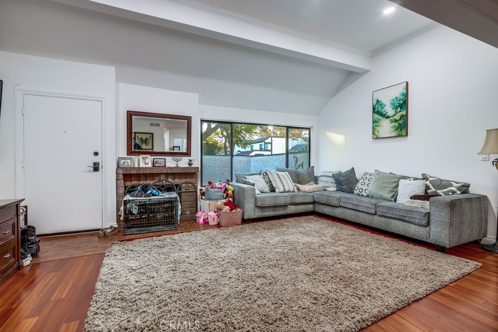 9678 Walker Court Cypress, CA 90630 - Photo 5 of 40 a living room with furniture and a flat screen tv