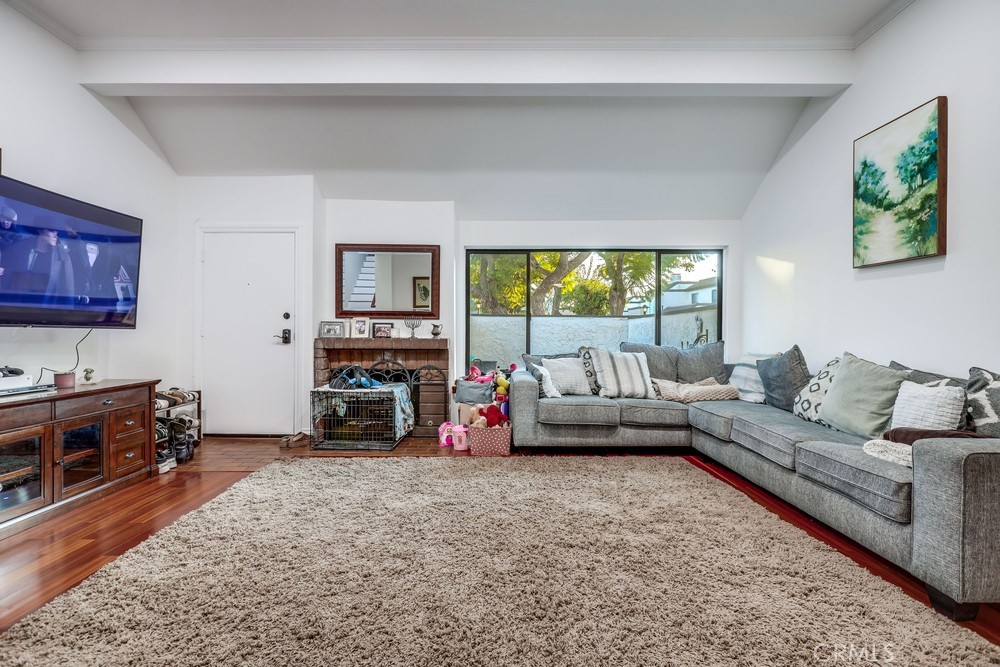 9678 Walker Court Cypress, CA 90630 - Photo 6 of 40 a living room with furniture and a fireplace