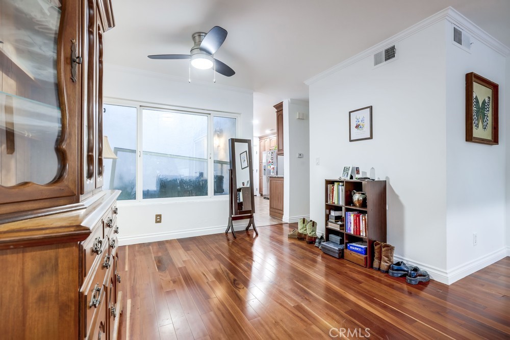 9678 Walker Court Cypress, CA 90630 - Photo 9 of 40 a view of a living room with hardwood floor and a ceiling fan