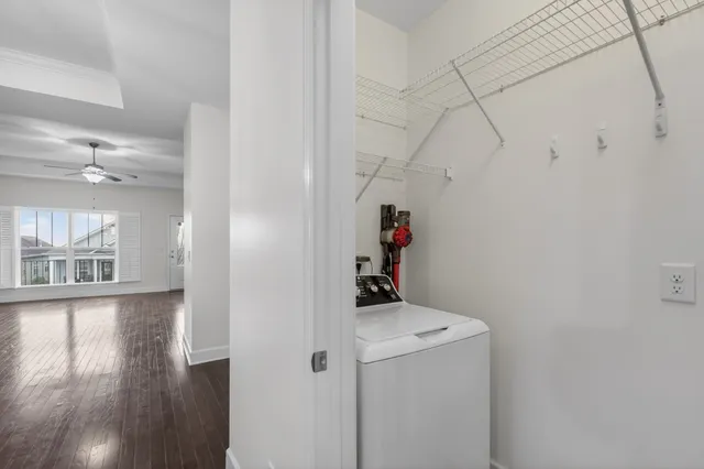 a view of entryway with window and wooden floor