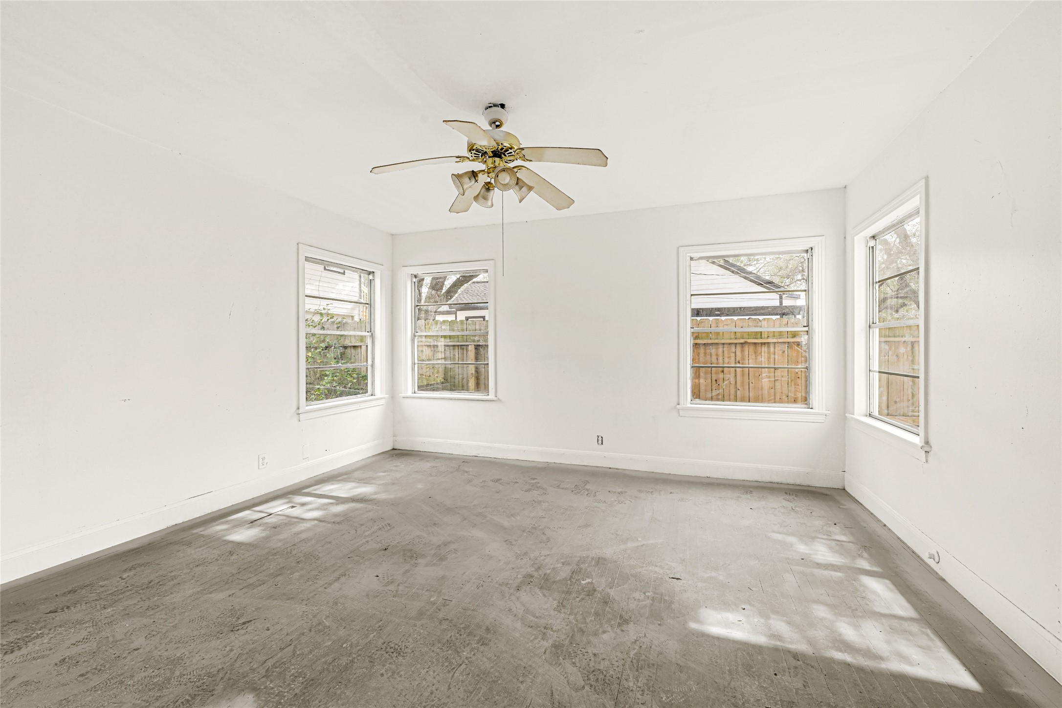 1202 North Roberson Street Conroe, TX 77301 - Photo 28 of 50 Bedroom with ceiling fan and windows